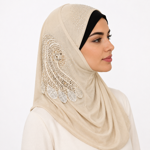 Beige lace one piece hijab with decorative side applique worn by a female model on a white background
