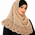 Beige hijab scarf with embroidered lace and small multicolor pearl bead details along the bottom edge.