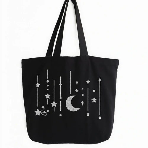 Black cotton tote bag with white crescent moon and hanging stars design, reusable Islamic shoulder bag for Ramadan, Eid, and everyday use