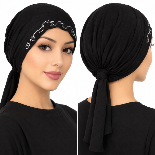 Woman modeling a black rhinestone tie-back hijab cap with decorative crystal swirl design on a white background.