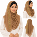 Woman wearing brown chiffon hijab with elegant gold embroidered edge