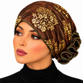 A woman wearing a brown and gold embroidered hijab headscarf, shown in a close-up profile shot against a plain white background.