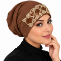 Brown gold underscarf cap with ornate pearl and sequin embellished front design modeled by a woman on a clean white background.