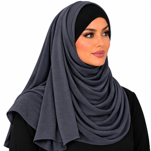 A woman wearing a dark gray draped hijab and a black undercap, shown from the chest up against a plain white background.