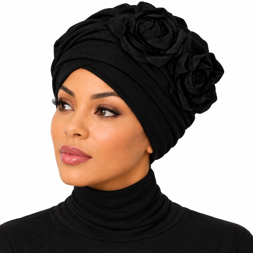 A woman wearing a black fabric turban headwrap with large decorative fabric roses, shown against a plain white background.