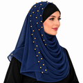 Navy blue chiffon hijab with gold bead details worn by a model