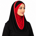 A woman wearing a black hijab with a vibrant red inner layer and a red trim featuring small white dot accents, shown against a plain white background.