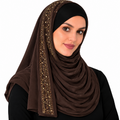 This brown jersey hijab is soft, stretchy, and easy to wear. The pretty rhinestone design runs along one side of the scarf and adds a touch of shine. The jersey fabric drapes nicely and feels comfortable for all-day wear. Great for everyday wear, work, Eid, parties, weddings, and special occasions.