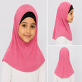 Girl modeling a short pink one piece hijab with an above-the-shoulder fit and one row of rhinestones around the front