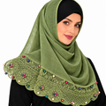 Green hijab scarf with embroidered lace and small multicolor pearl bead details along the bottom edge.