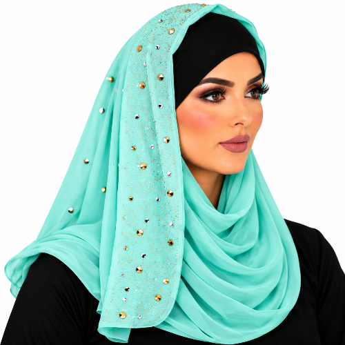 Woman wearing a mint chiffon hijab with sparkling rhinestone details and a black undercap