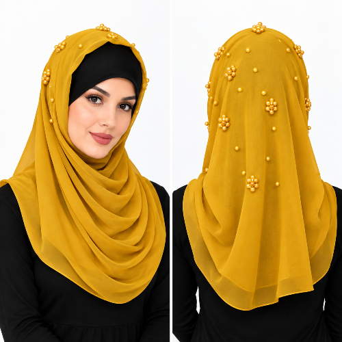 Mustard yellow pearl beaded hijab scarf for women with gold pearl details on the top and back, shown on a female model.