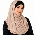 Nude beige jersey hijab scarf with soft layered draping, full coverage, and a black undercap on a clean white background.