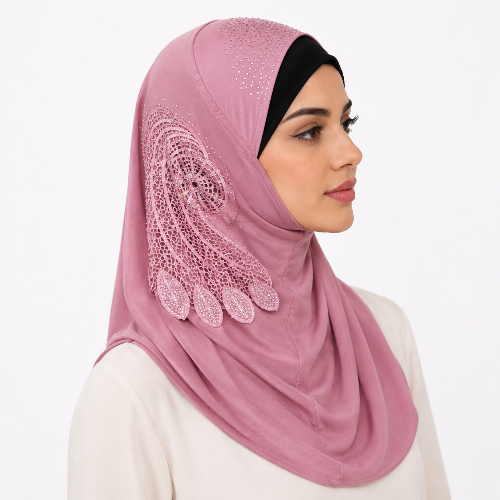 Pink rhinestone one piece hijab with decorative side applique worn by a female model on a white background