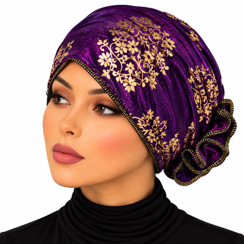 Woman wearing a purple turban with elegant gold floral patterns