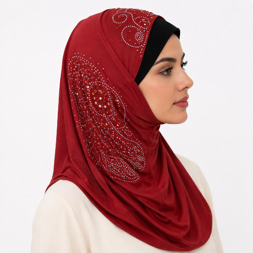 Red rhinestone one piece hijab with sparkling side embellishment worn by a female model on a white background