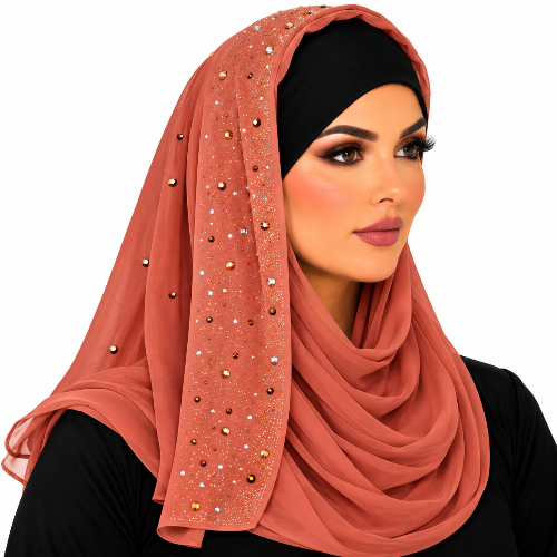 Woman wearing a rust chiffon hijab with sparkling rhinestone details and a black undercap